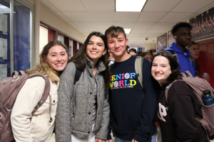  Students smiling in the hallway